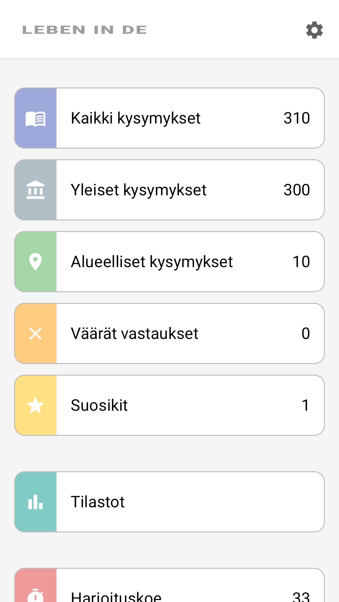 Sovelluksen aloitusnäyttö suomeksi: kaikki kysymykset, alueelliset kysymykset, suosikit, tilastot