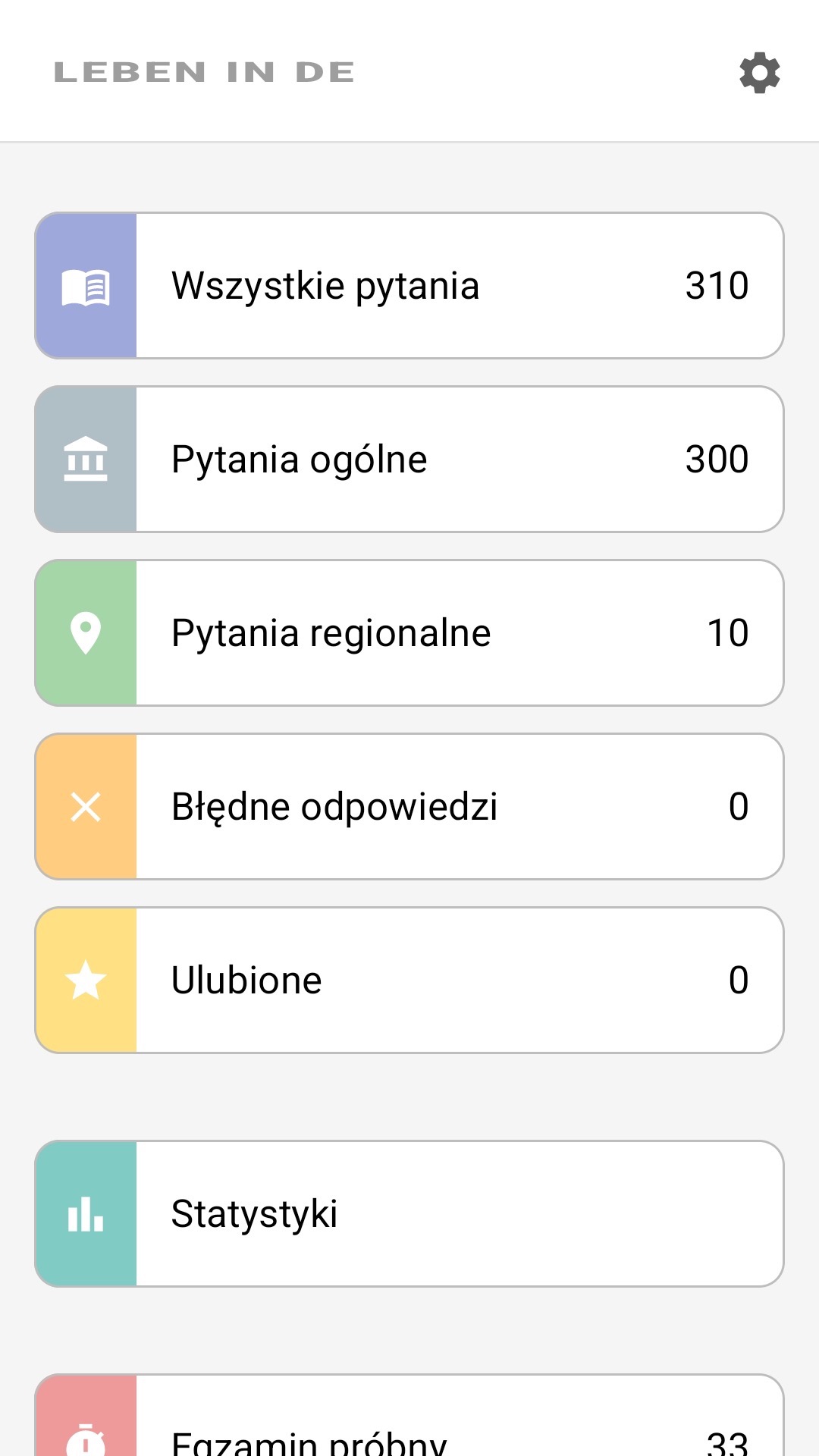 Ekran główny aplikacji po polsku: wszystkie pytania, pytania regionalne, ulubione, statystyki